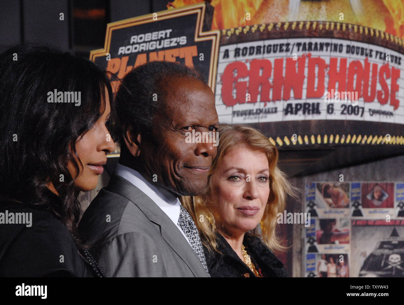 Actor Sydney Poitier (C) arrives with his wife Joanna Shimkus (R) and their daughter for the premiere of the motion picture sci-fi crime thriller 'Grindhouse' at the Orpheum Theatre in Los Angeles on March 26, 2007. The movie features two full length horror movies, 'Death Proof' and 'Planet Terror', written and directed respectively by Quentin Tarantino and Robert Rodriguez. (UPI Photo/Jim Ruymen) Stock Photo