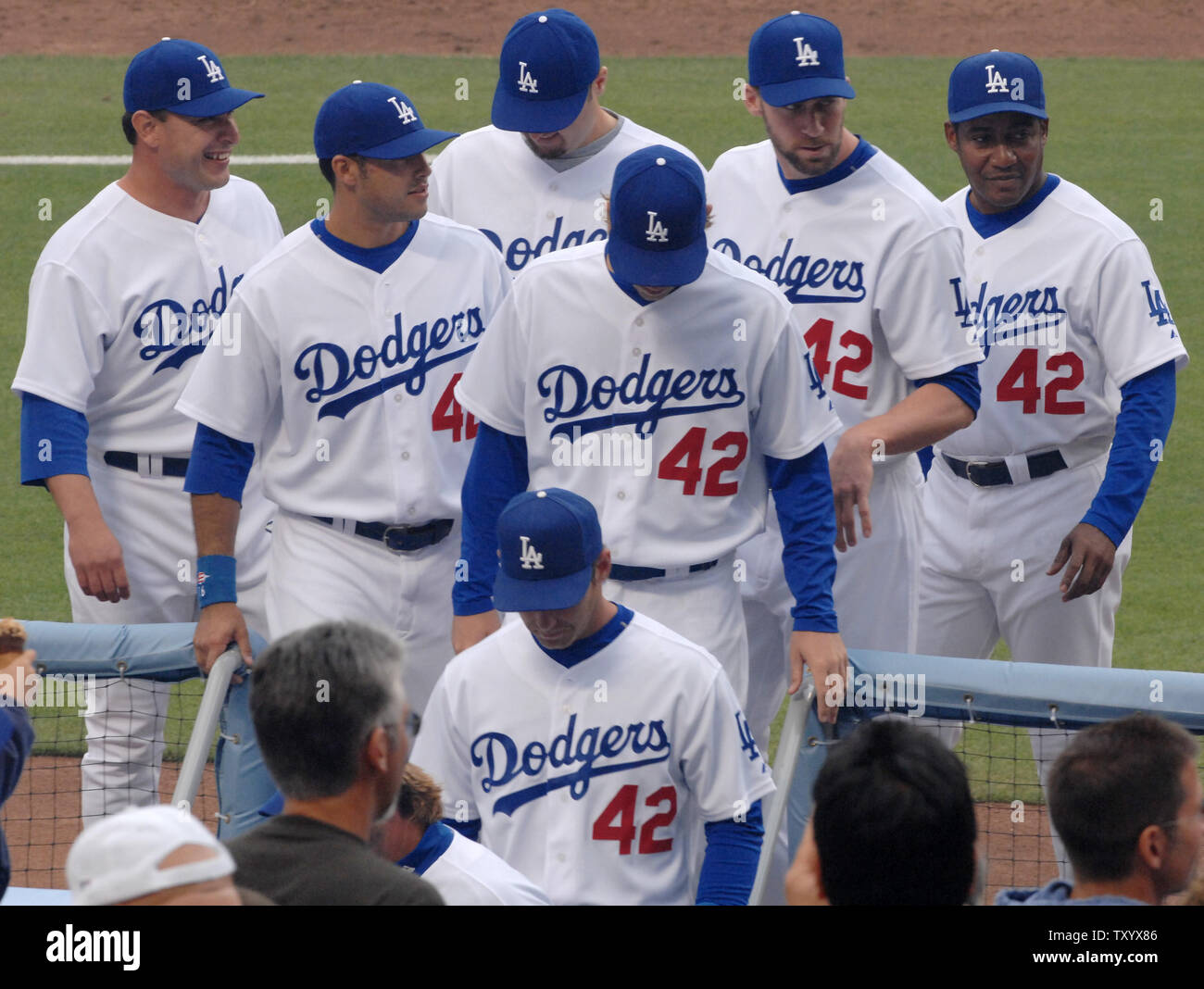Los Angeles Dodgers return to the dugout prior to their game with the