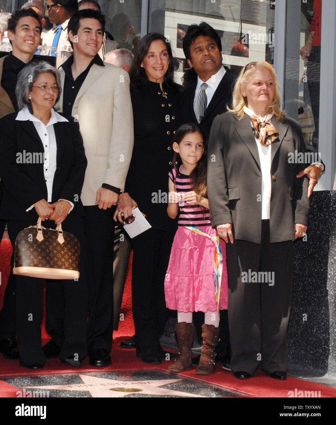 Actor Erik Estrada, right rear, best known for his role as Officer Frank 'Ponch' Poncherello in the 1977-1983 television series 'CHiPS' poses with young daughter Francesca, his mother Carmen and wife Nanette (R) along with other unidentified family members after his star was unveiled on the Hollywood Walk of Fame in Los Angeles on April 19, 2007. (UPI Photo/Jim Ruymen) Stock Photo