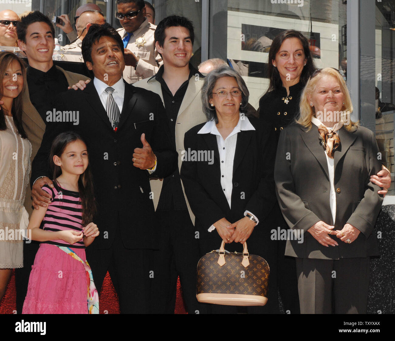 Actor Erik Estrada (2nd-L), best known for his role as Officer Frank 'Ponch' Poncherello in the 1977-1983 television series 'CHiPS' poses with young daughter Francesca, his mother Carmen and wife Nanette (R) along with other unidentified family members after his star was unveiled on the Hollywood Walk of Fame in Los Angeles on April 19, 2007. (UPI Photo/Jim Ruymen) Stock Photo