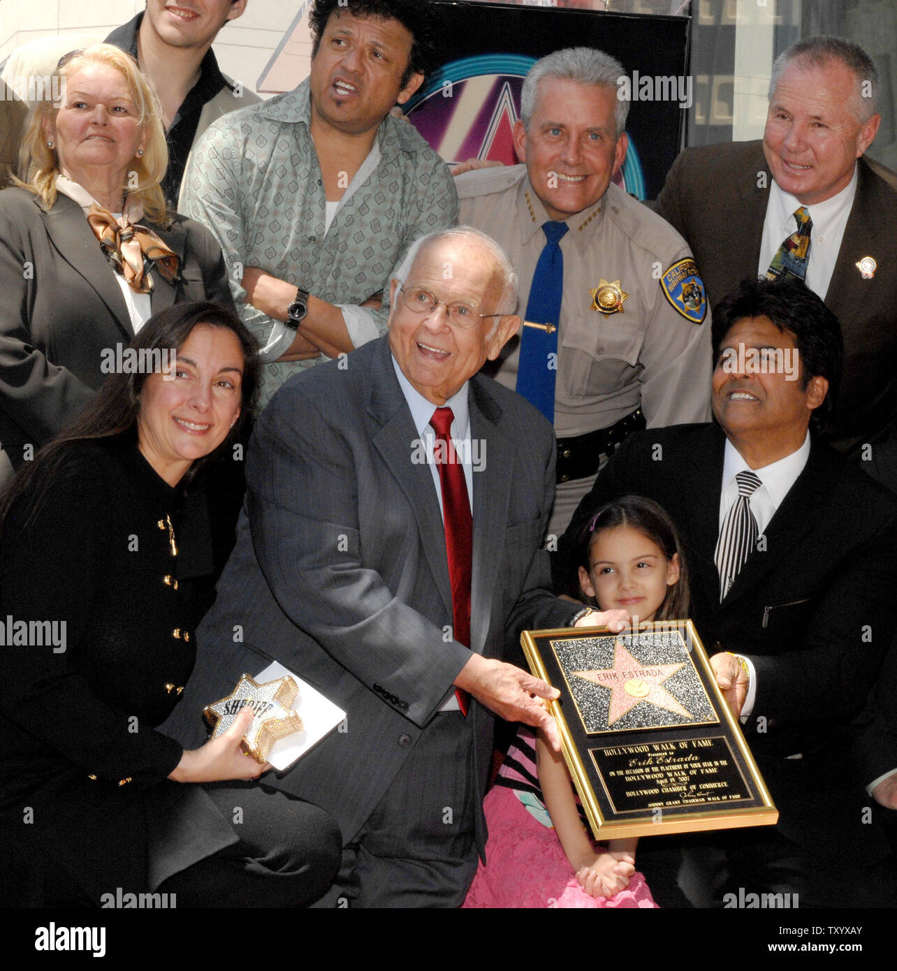 Actor Erik Estrada, lower right, best known for his role as Officer Frank 'Ponch' Poncherello in the 1977-1983 television series 'CHiPS' poses with young daughter Francesca, his mother Carmen and wife Nanette (L) along with other unidentified supporters after his star was unveiled on the Hollywood Walk of Fame in Los Angeles on April 19, 2007. (UPI Photo/Jim Ruymen) Stock Photo
