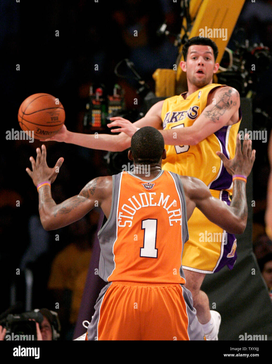 Los Angeles Lakers' Jordan Farmar drives the baseline against Houston  Rockets' Chuck Hayes during Game 5 of their Western Conference semifinals  at Staples Center in Los Angeles on May 12, 2009. The