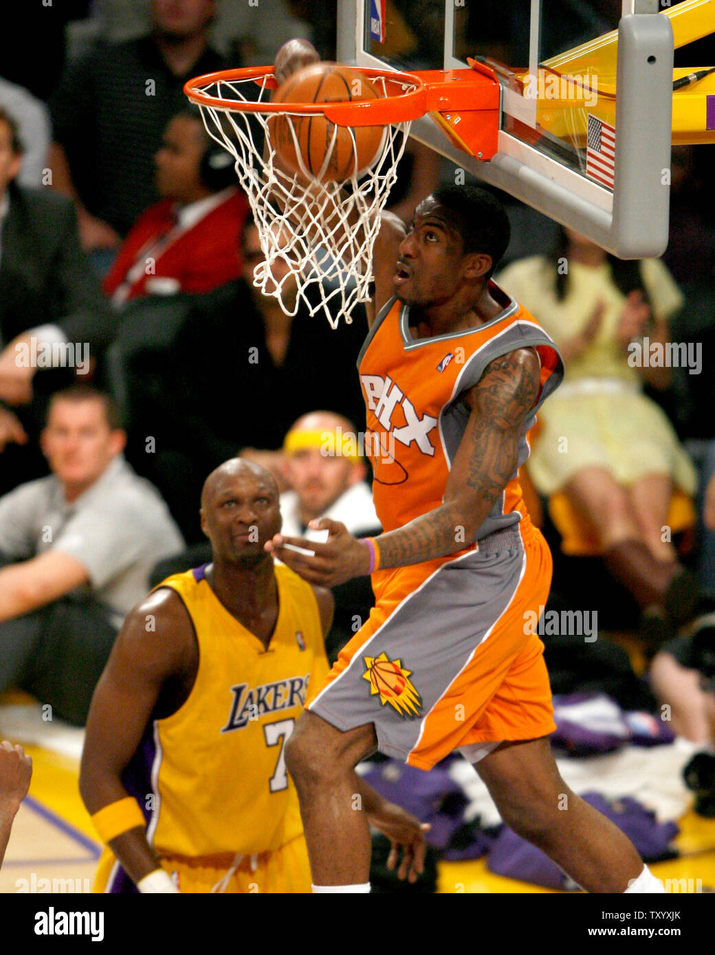 Phoenix Suns'  Center Amare Stoudemire (1)  dunks over Los Angeles Lakers' forward Lamar Odom (7)  during second quarter action of game three of their Western Conference quarterfinals at Staples Center in Los Angeles on April 26, 2007. The Lakers beat the Suns 95-89. (UPI Photo/Jon SooHoo) Stock Photo