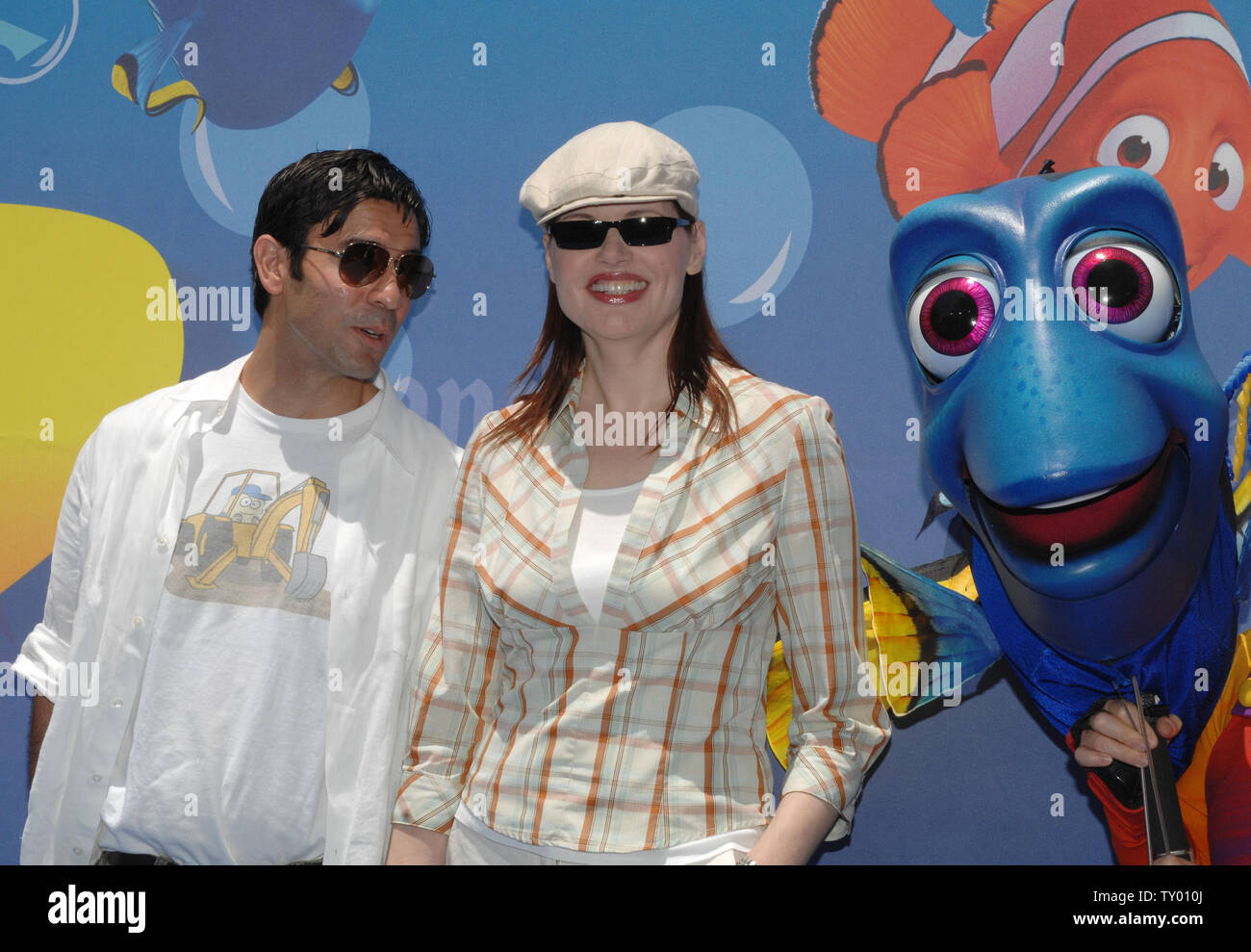 Actress Geena Davis (R) and her husband Dr. Reza Harlin arrive for the