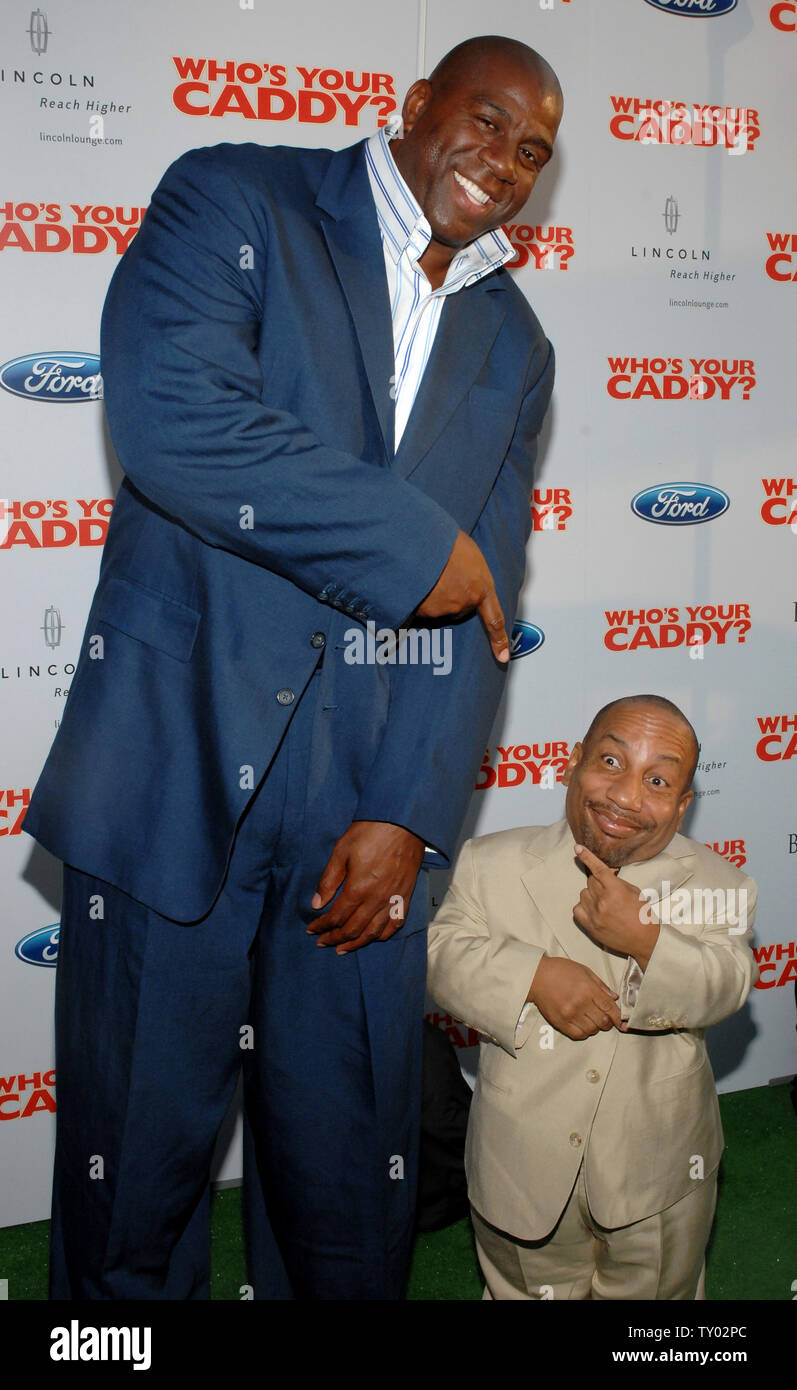 Cast member Tony Cox (R) and former NBA player Ervin "Magic" Johnson share a laugh as they