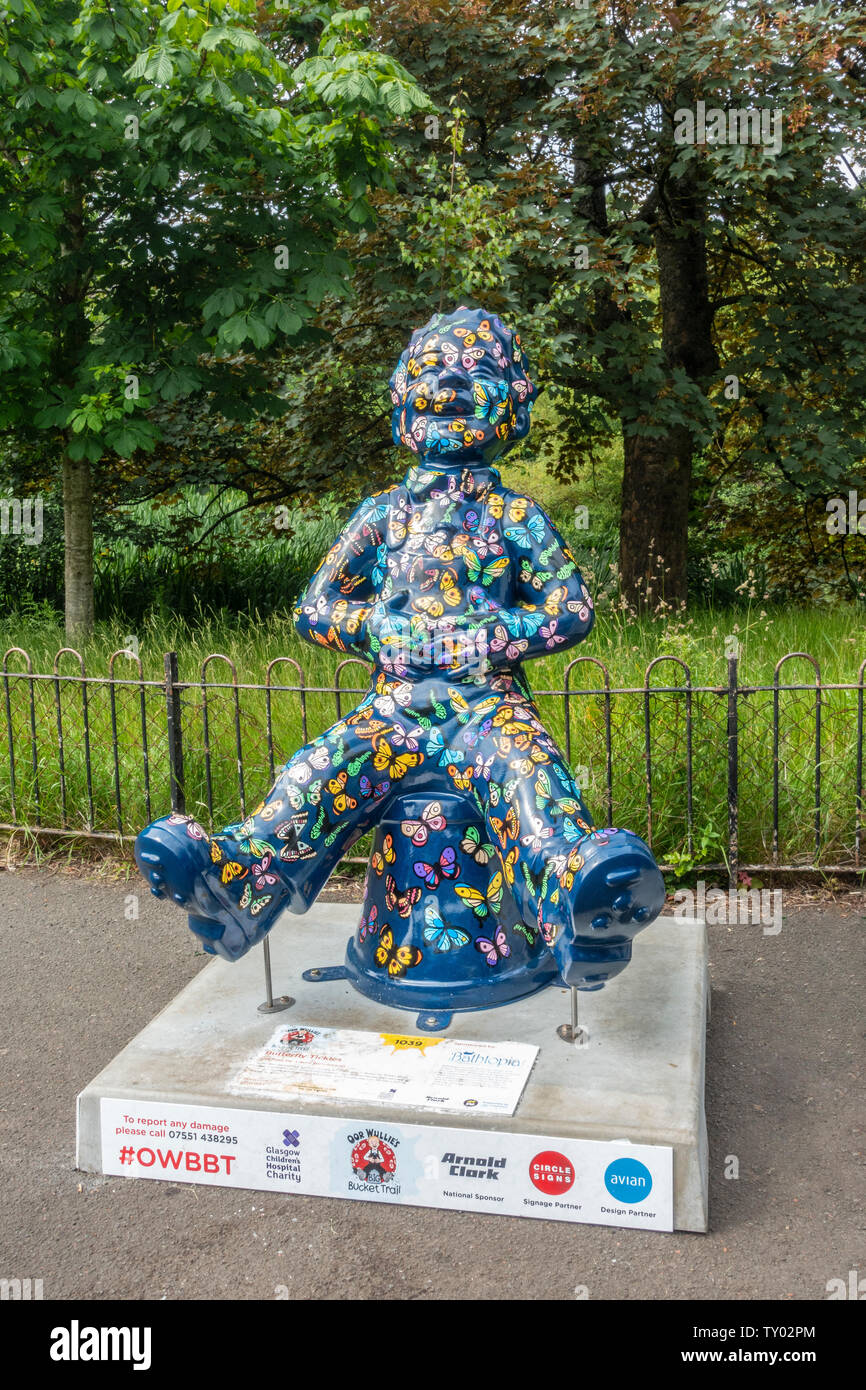 Butterfly Tickles, by Laura Henderson, one of the statues of Oor Wullie on the Oor Wullie's Big Bucket Trail 2019. Kelvingrove Park, Glasgow, Scotland Stock Photo