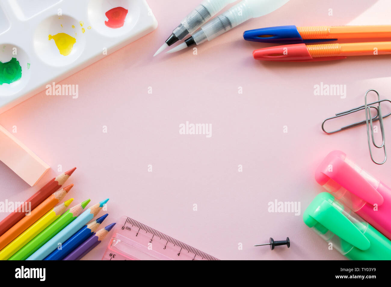 School drawing supplies on pink background. Free space for text Stock Photo