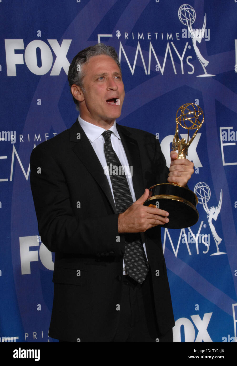 Jon Stewart appears backstage with the Emmy he won for work on 'The