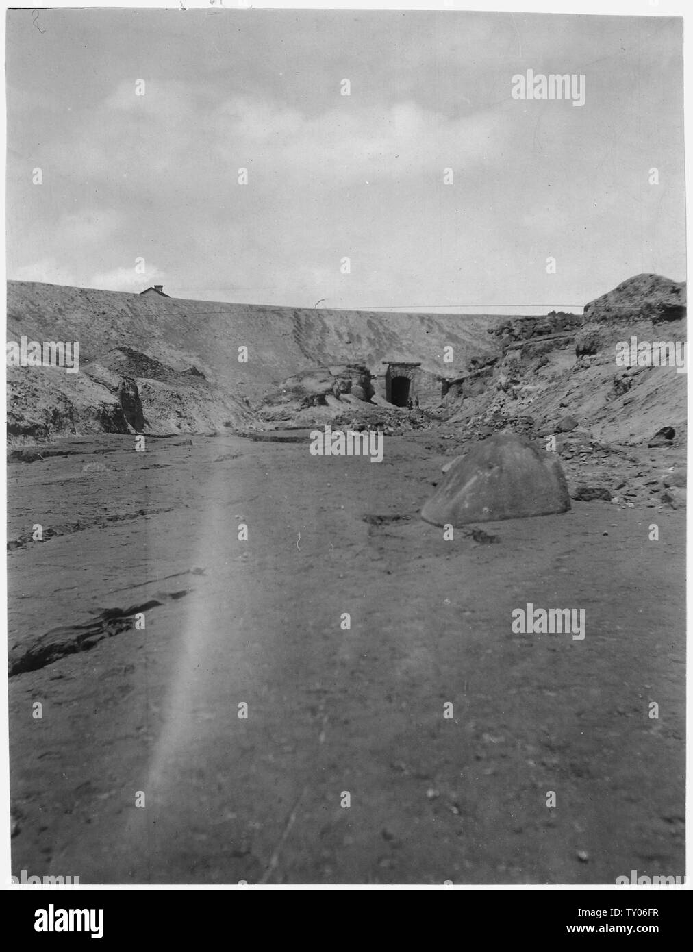 culvert, B,A & P Ry., Missoula Gulch; Scope and content:  From Hugh Magone v. Colorado Smelting and Refinig Co., et.al. Magone sued for damaged because the piles of tailings from the ore concentrator and smelter operated by Anaconda poluted the waters of the Deer Lodge River and his farm in Deer Lodge Valley. Citing the economic benefit of the mines and smelters to the region the Master of the Chancery said the plaintiff ought to have known the water was polluted and refused to award monetary damages. Stock Photo