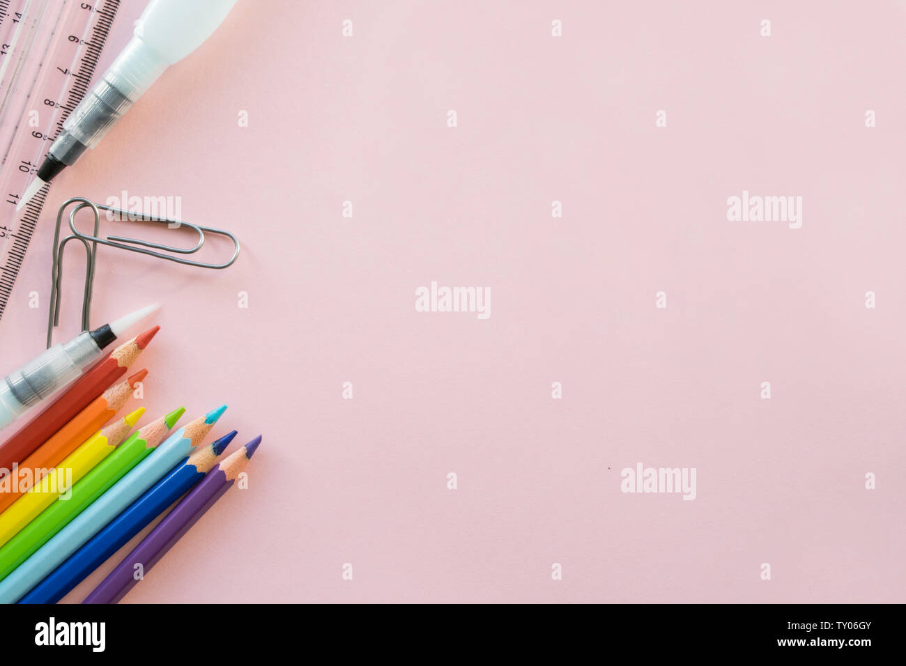 School drawing supplies on pink background. Free space Stock Photo