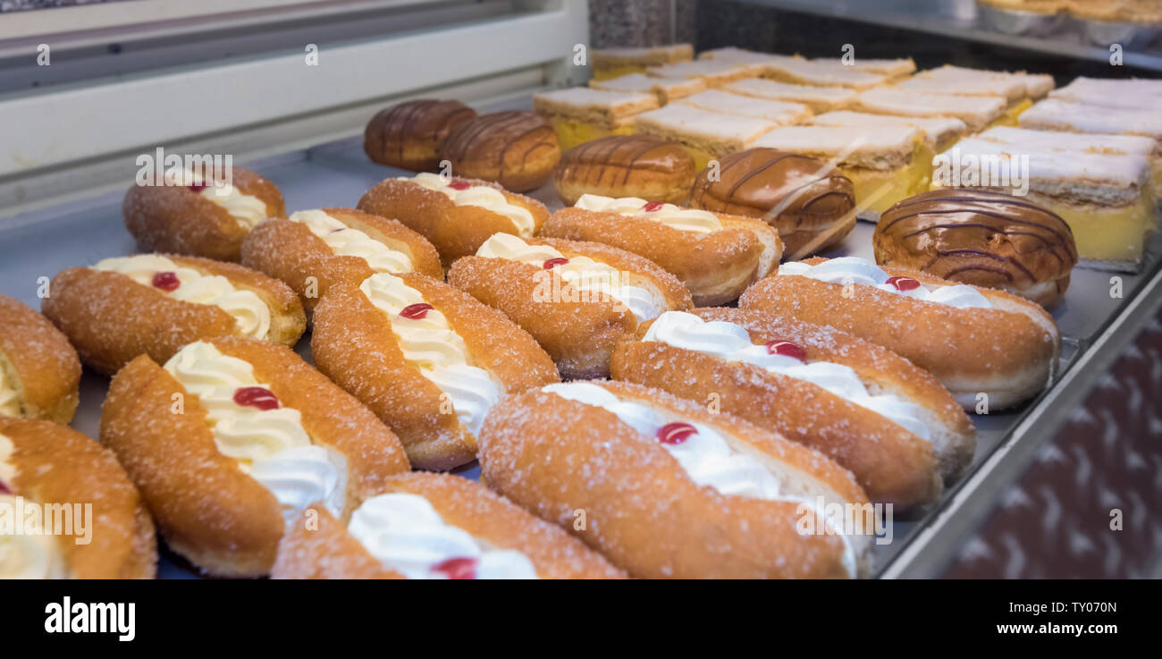 Cream Cakes For Sale In Retail Display Cabinet Stock Photo