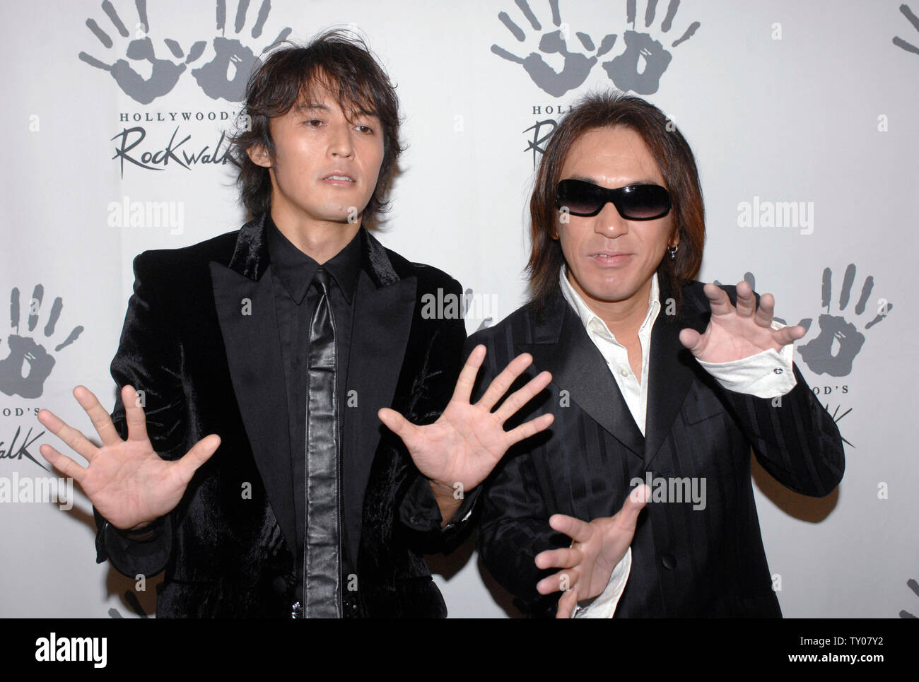 Vocalist Koshi Inaba (L) and Guitarist Tak Matsumoto of the Japanese