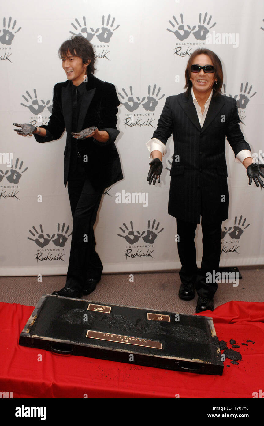 Vocalist Koshi Inaba (L) and Guitarist Tak Matsumoto of the Japanese