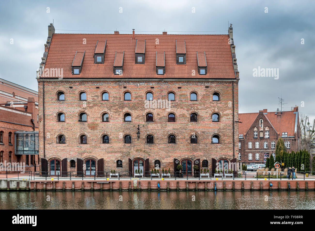 Gdansk, Poland – Feb 14, 2019: View at historic houses along Motlawa river in the old historic town of the Gdansk city in Poland. It is one of many to Stock Photo