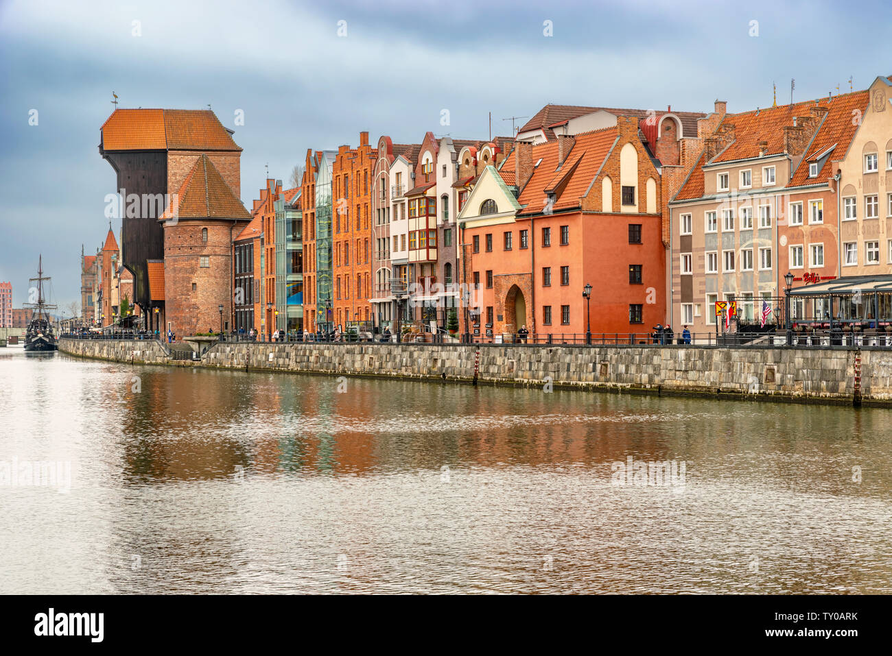 Gdansk, Poland – Feb 14, 2019: The classic view of Gdansk with the historic Gdansk Crane and the Hanseatic-style buildings along River Motlawa, Poland Stock Photo