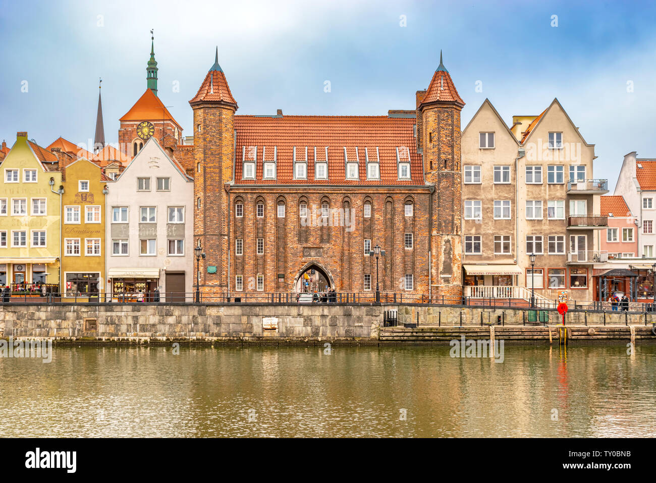 Gdansk, Poland – Feb 14, 2019: View at historic houses and the Mariacka Gate building facade along Motlawa river in Gdansk, Poland Stock Photo