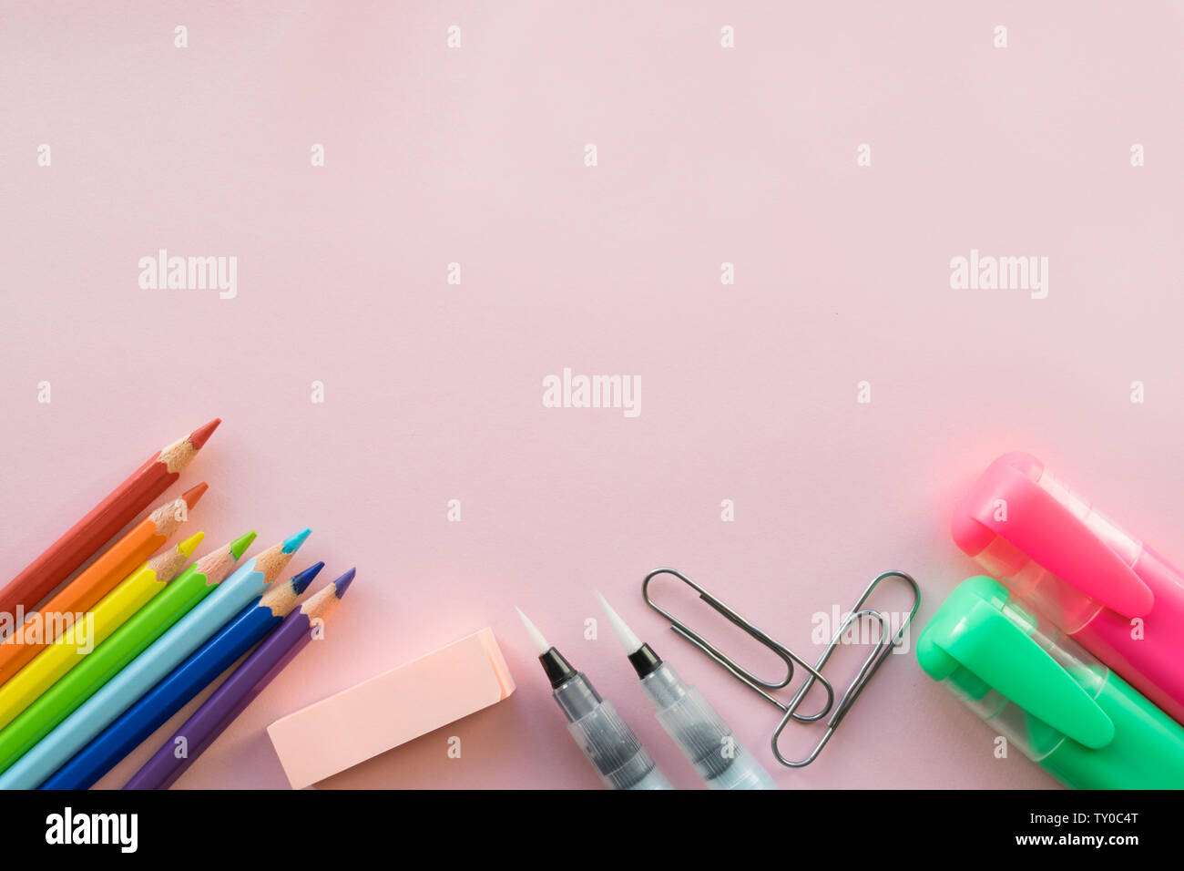 Office supplies on pink background. Free space Stock Photo