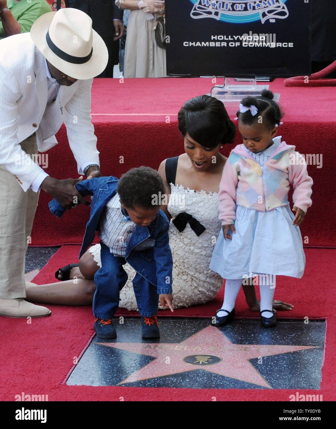 Actress Angela Bassett (R) and her husband, actor Cortney B. Vance gather around her star with their son Slater Josiah and daughter Bronwyn Golden during an unveiling ceremony honoring Bassett with the 2,358th star on the Hollywood Walk of Fame in Los Angeles on March 20, 2008. (UPI Photo/Jim Ruymen) Stock Photo