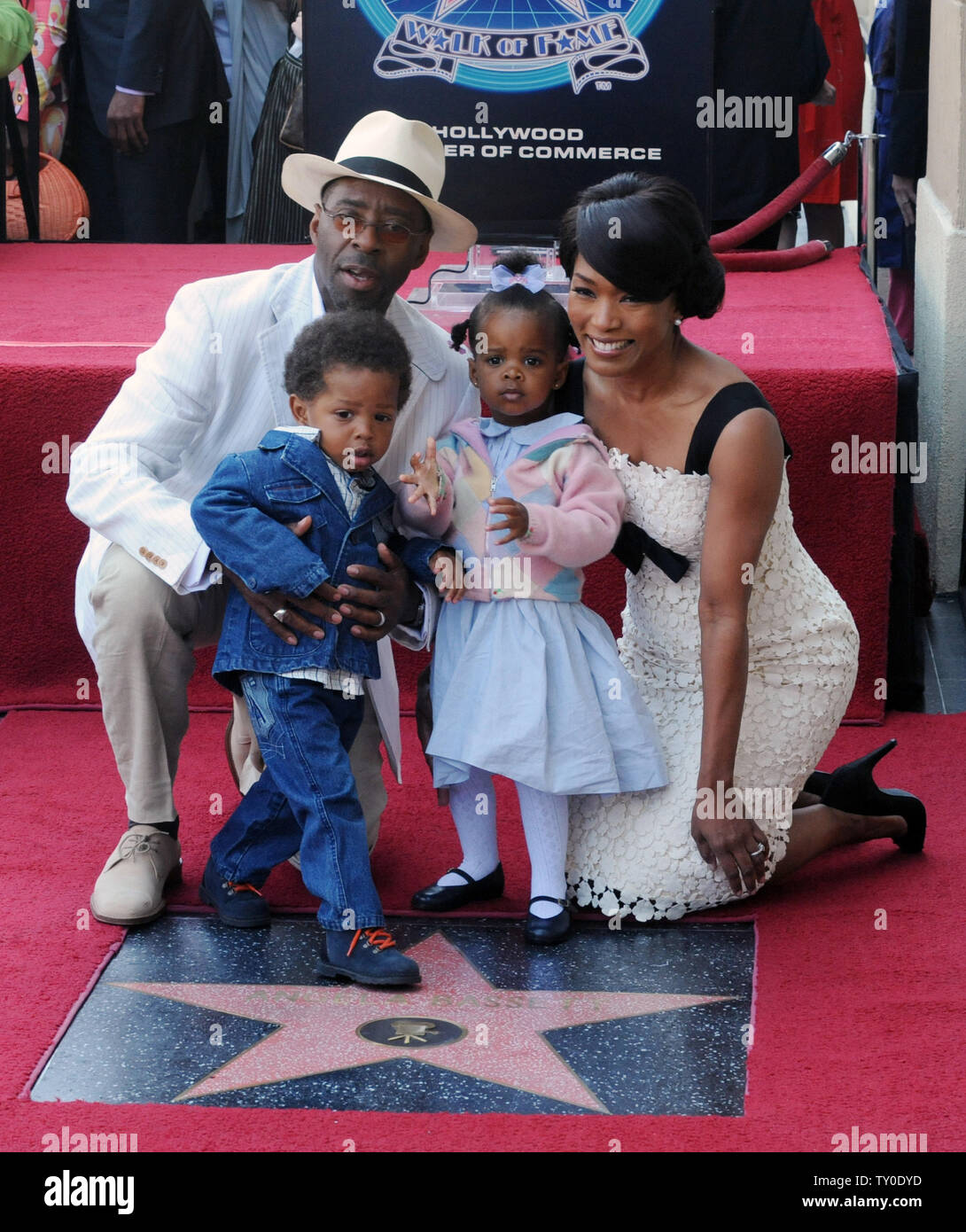 Actress Angela Bassett (R) and her husband, actor Cortney B. Vance gather around her star with their son Slater Josiah and daughter Bronwyn Golden during an unveiling ceremony honoring Bassett with the 2,358th star on the Hollywood Walk of Fame in Los Angeles on March 20, 2008. (UPI Photo/Jim Ruymen) Stock Photo