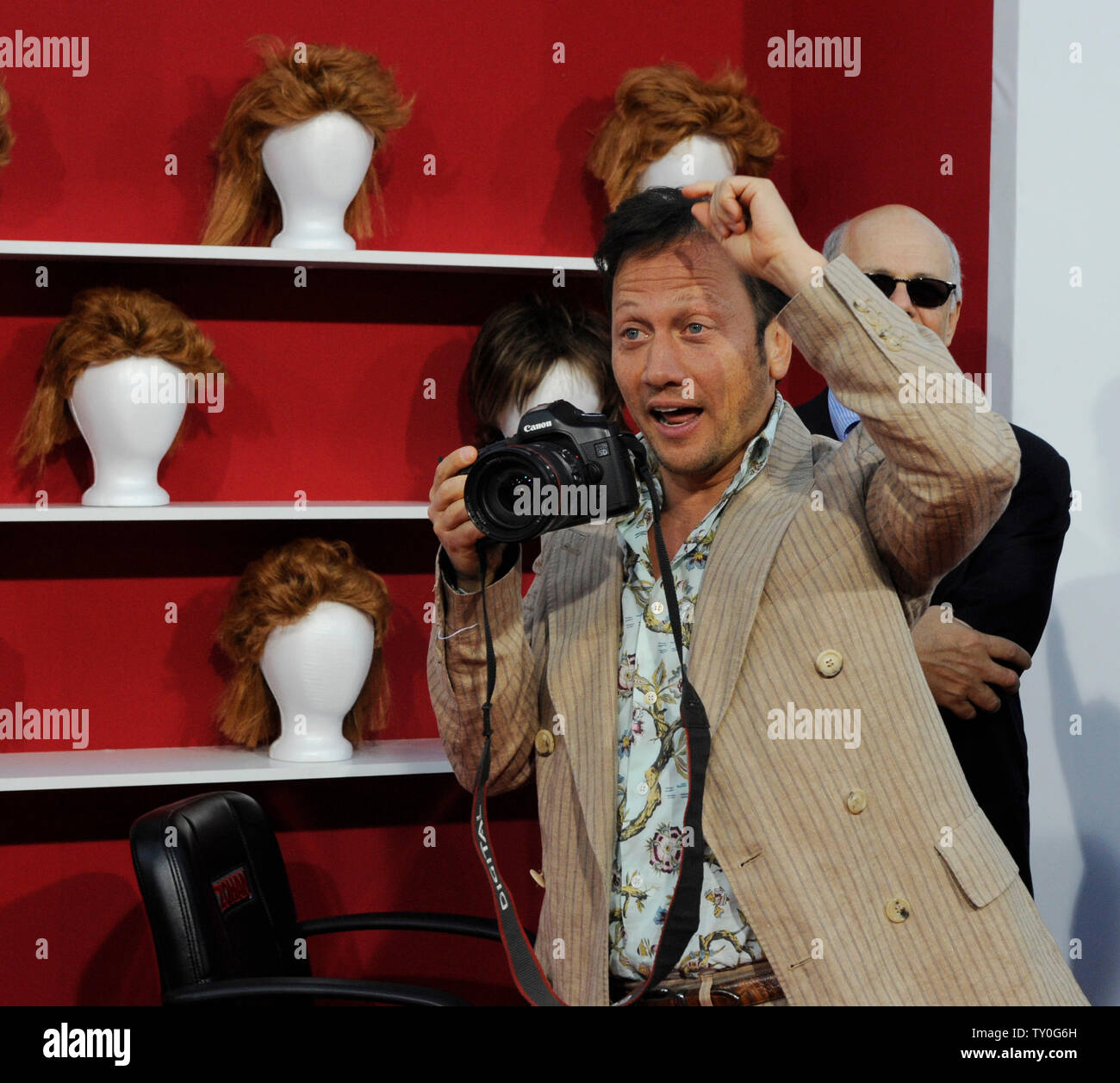 Rob Schneider, a cast member in the motion picture comedy 'You Don't Mess With the Zohan', playfully takes a photo as he attends the premiere of the film at Grauman's Chinese Theatre in the Hollywood section of Los Angeles on May 28, 2008.  (UPI Photo/Jim Ruymen) Stock Photo