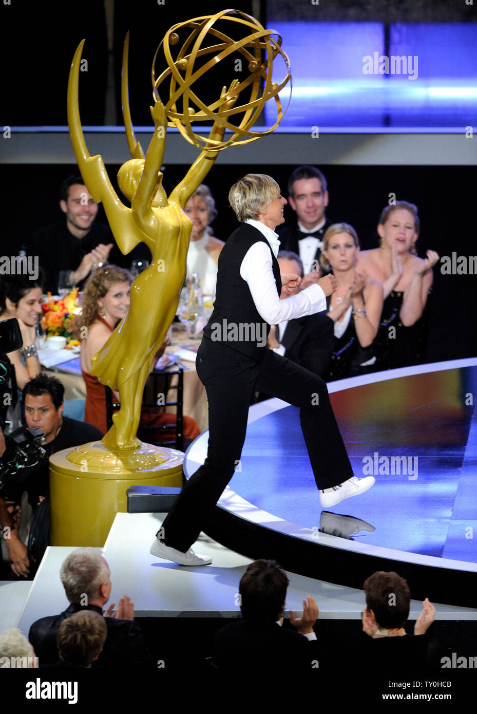 Actress Ellen DeGeneres walks on stage after winning outstanding talk