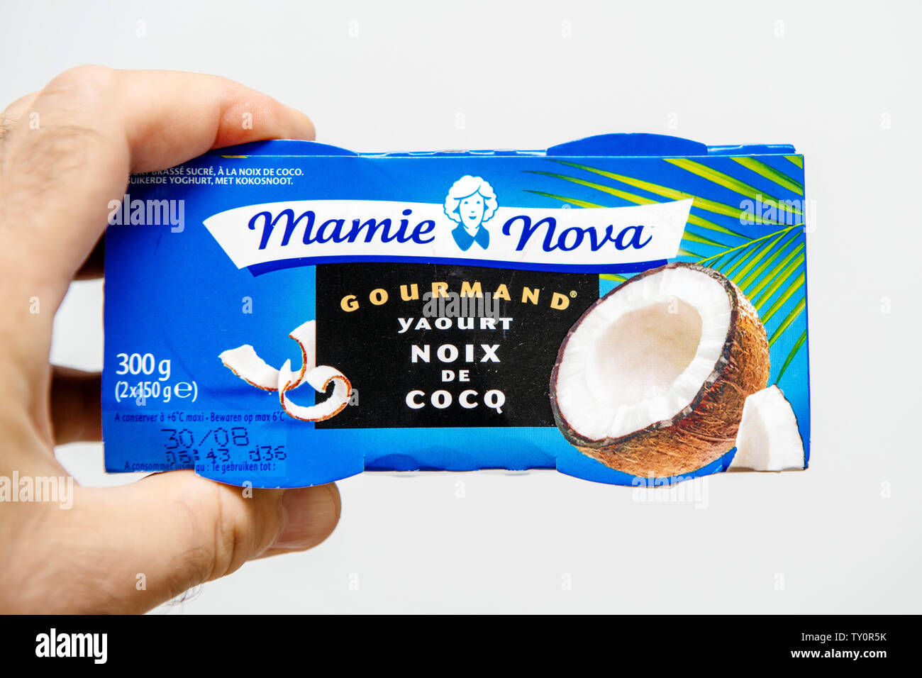 Strasbourg, France - Aug 11, 2018: Man hand holding Mamie Nova Gourmand  Coconut yogurt pack Stock Photo - Alamy