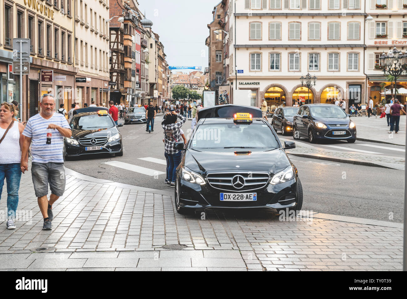 STRASBOURG, FRANCE - SEP 21, 2014: White Mercedes-Benz E Class taxi parked  on a rainy day in center of Strasbourg, place Kleber next to cafe Stock  Photo - Alamy