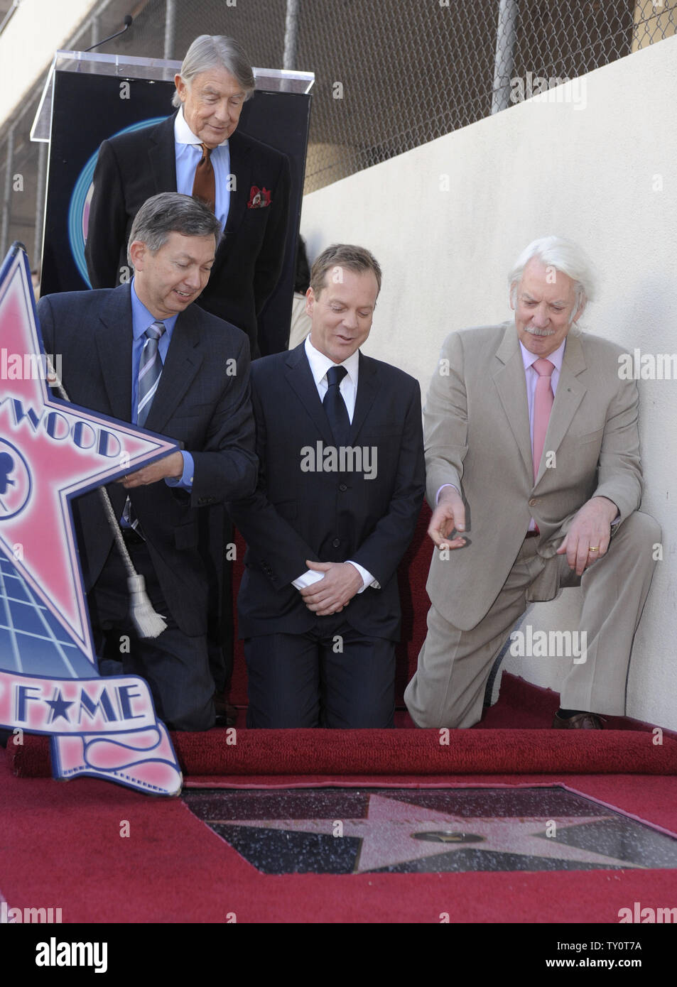 (L to R) Hollywood Chamber of Commerce President Leron Gubler, director Joel Schumacher, Kiefer Sutherland and Donald Sutherland participate in the unveiling ceremony honoring Kiefer Sutherland with a star on the Hollywood Walk of Fame on December 9, 2008. (UPI Photo/ Phil McCarten) Stock Photo