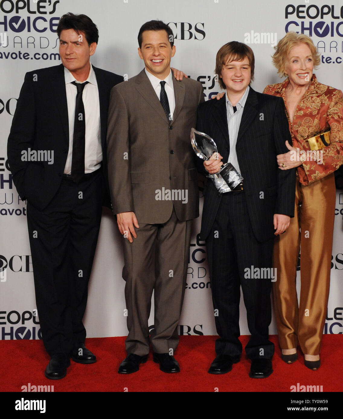 From left, Charlie Sheen, Jon Cryer, Angus T. Jones and Holland Taylor  appear backstage with their favorite TV comedy award for "Two and a Half Men"  at the 35th annual People's Choice