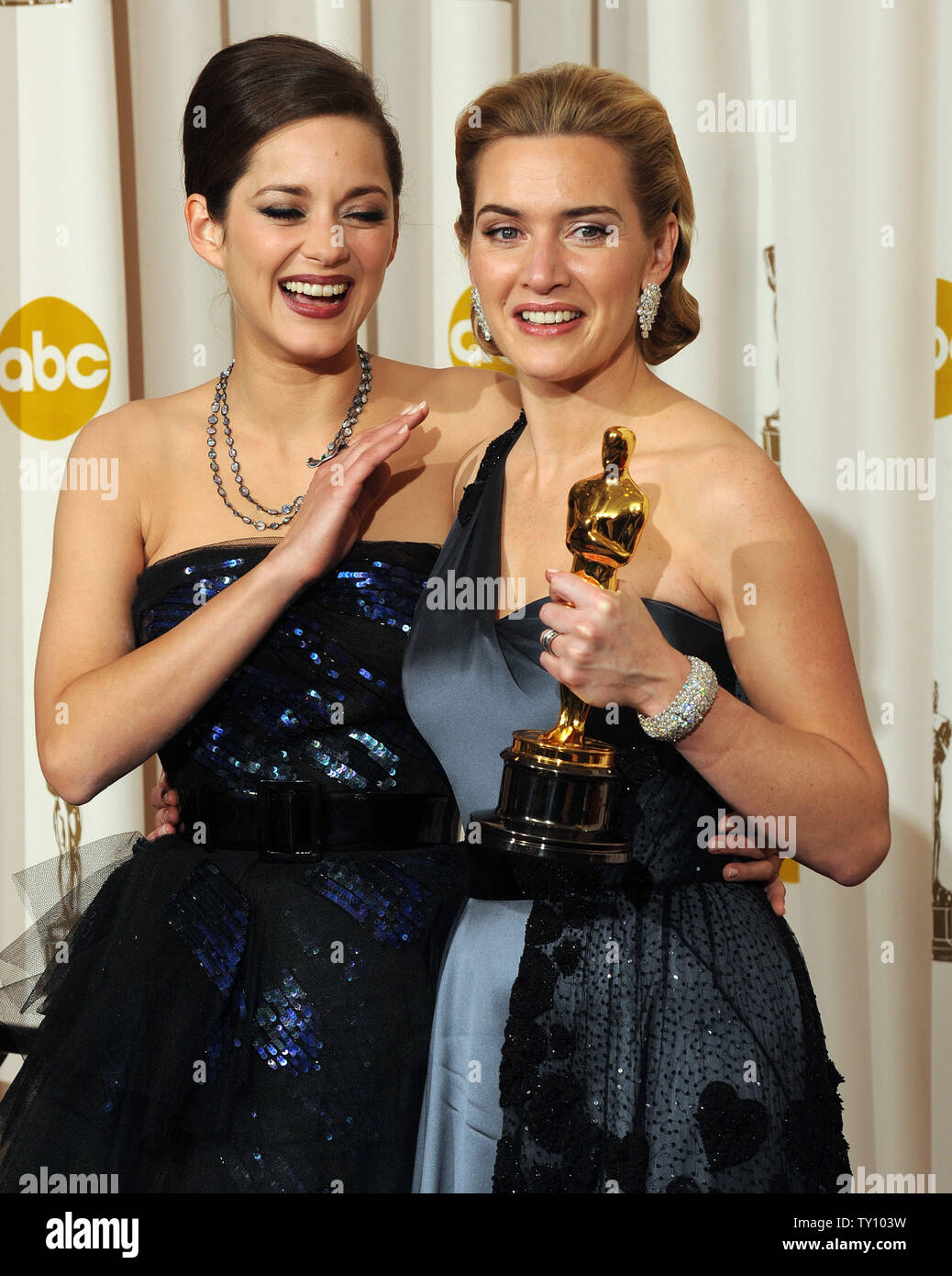Presenter actress Marion Cotillard (L) and Kate Winslet, best actress