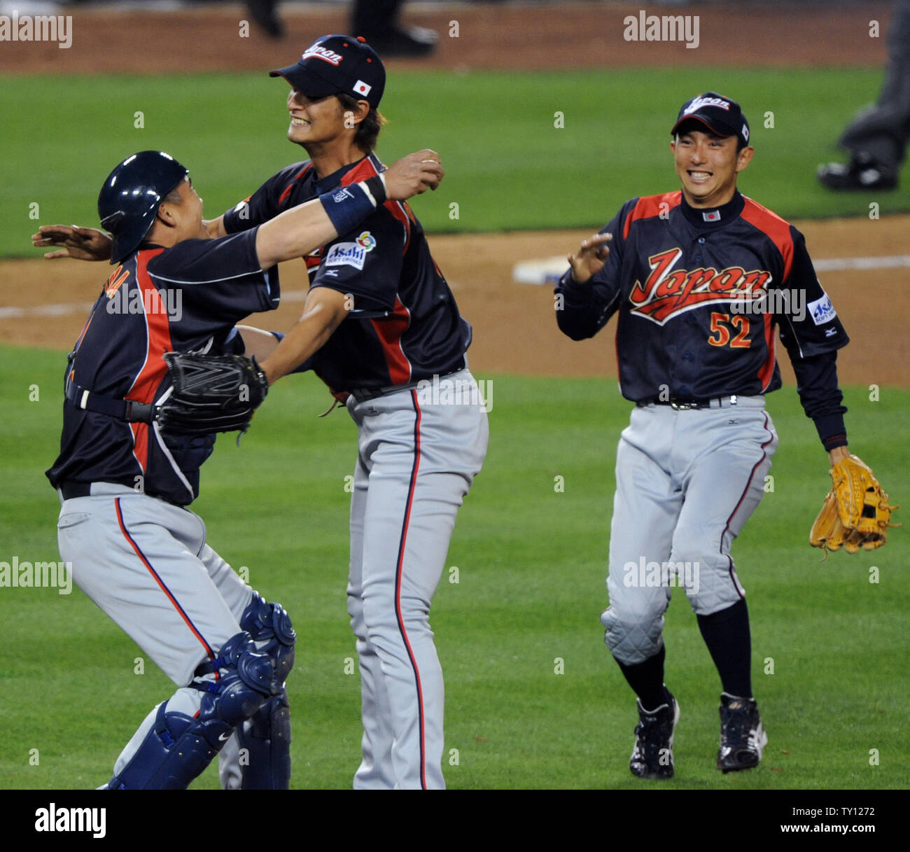 Team Japan's pitcher Yu Darvish (C) and catcher Kenji Johjima (L ...