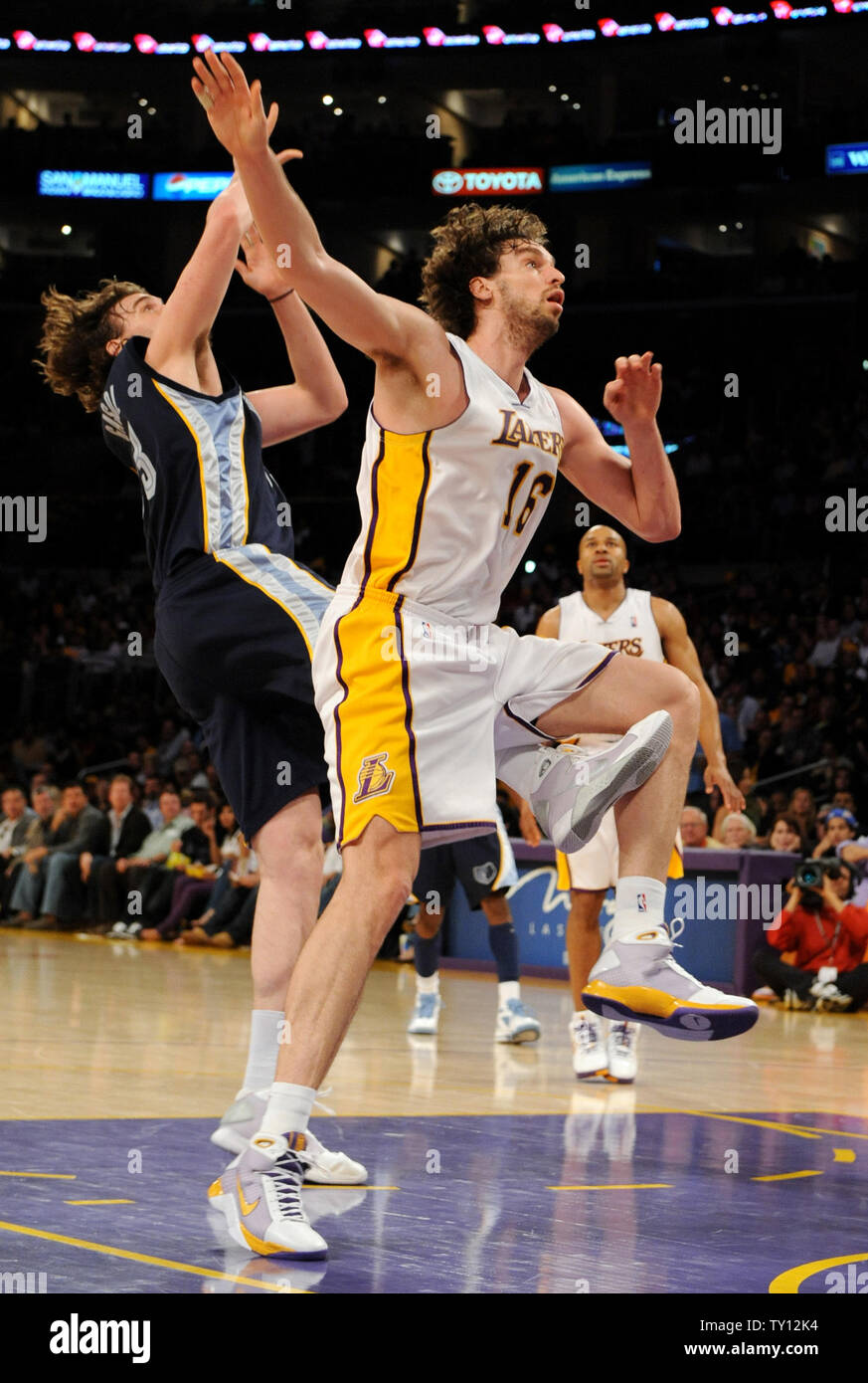 Los Angeles Lakers center Pau Gasol (16) of Spain, and his brother and  Memphis Grizzlies center Marc Gasol (33) jockey for position during the  first half of an NBA basketball game in