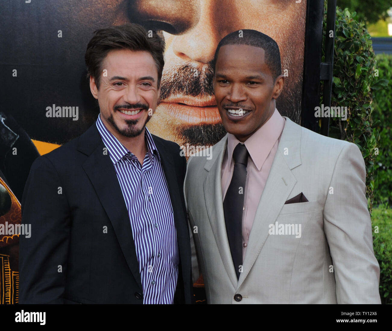 Jamie Foxx (R) and Robert Downey, Jr., costars in the biographical