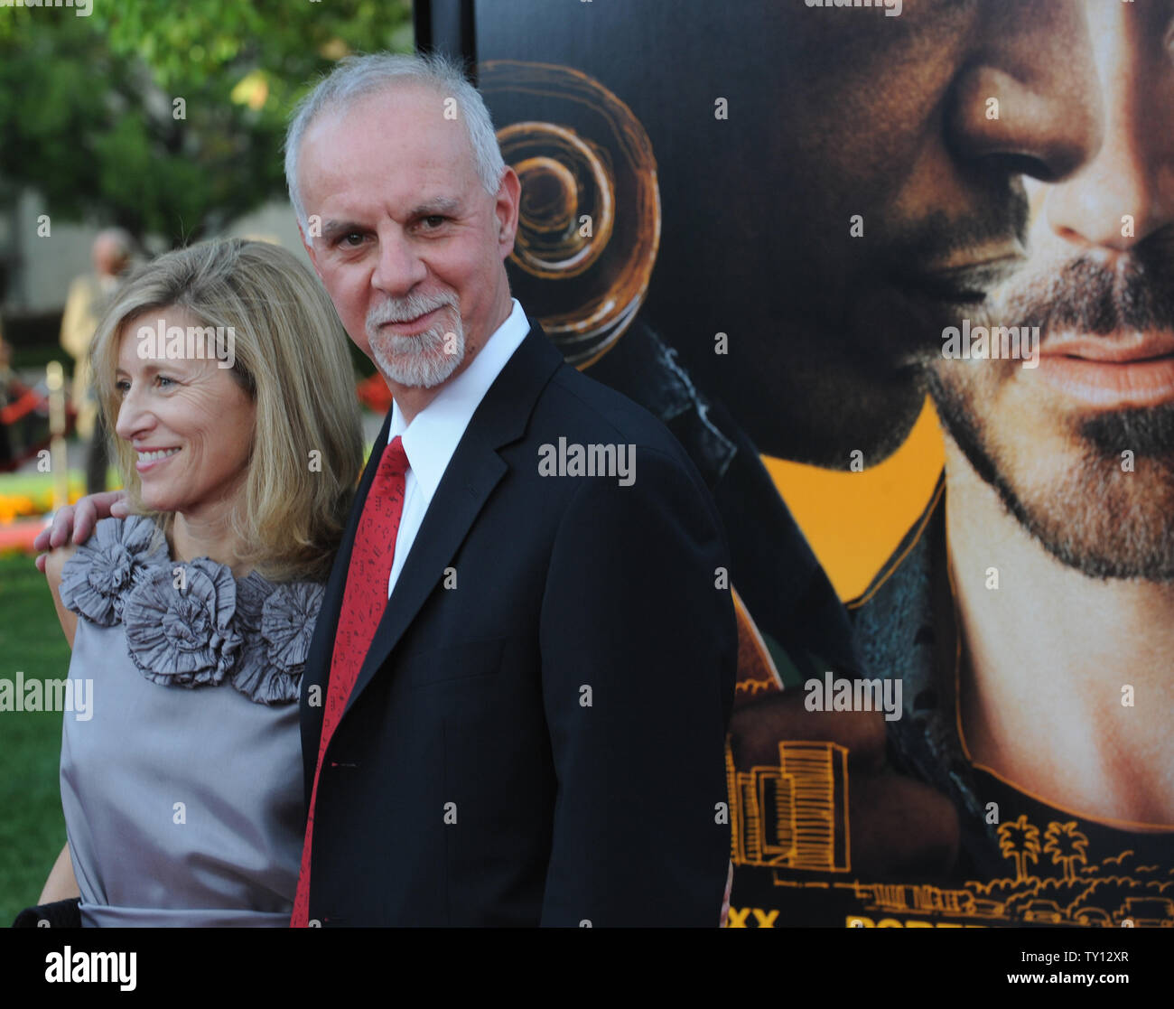 Los Angeles Times columnist Steve Lopez, who is portrayed by Robert Downey,  Jr. in the motion picture biographical drama The Soloist, attends the  premiere of the film with his wife Alison on