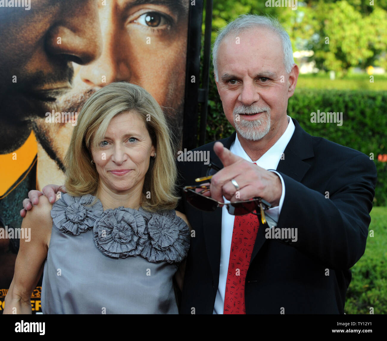 Los Angeles Times columnist Steve Lopez, who is portrayed by Robert Downey,  Jr. in the motion picture biographical drama The Soloist, attends the  premiere of the film with his wife Alison on