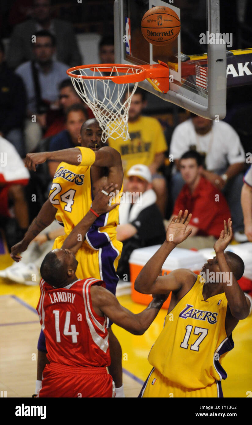 Los Angeles Lakers Kobe Bryant 24 blocks a shot by the Houston Rockets Carl Landry 14 during the first half of their NBA Western Conference Semi Final game 1 in Los Angeles on