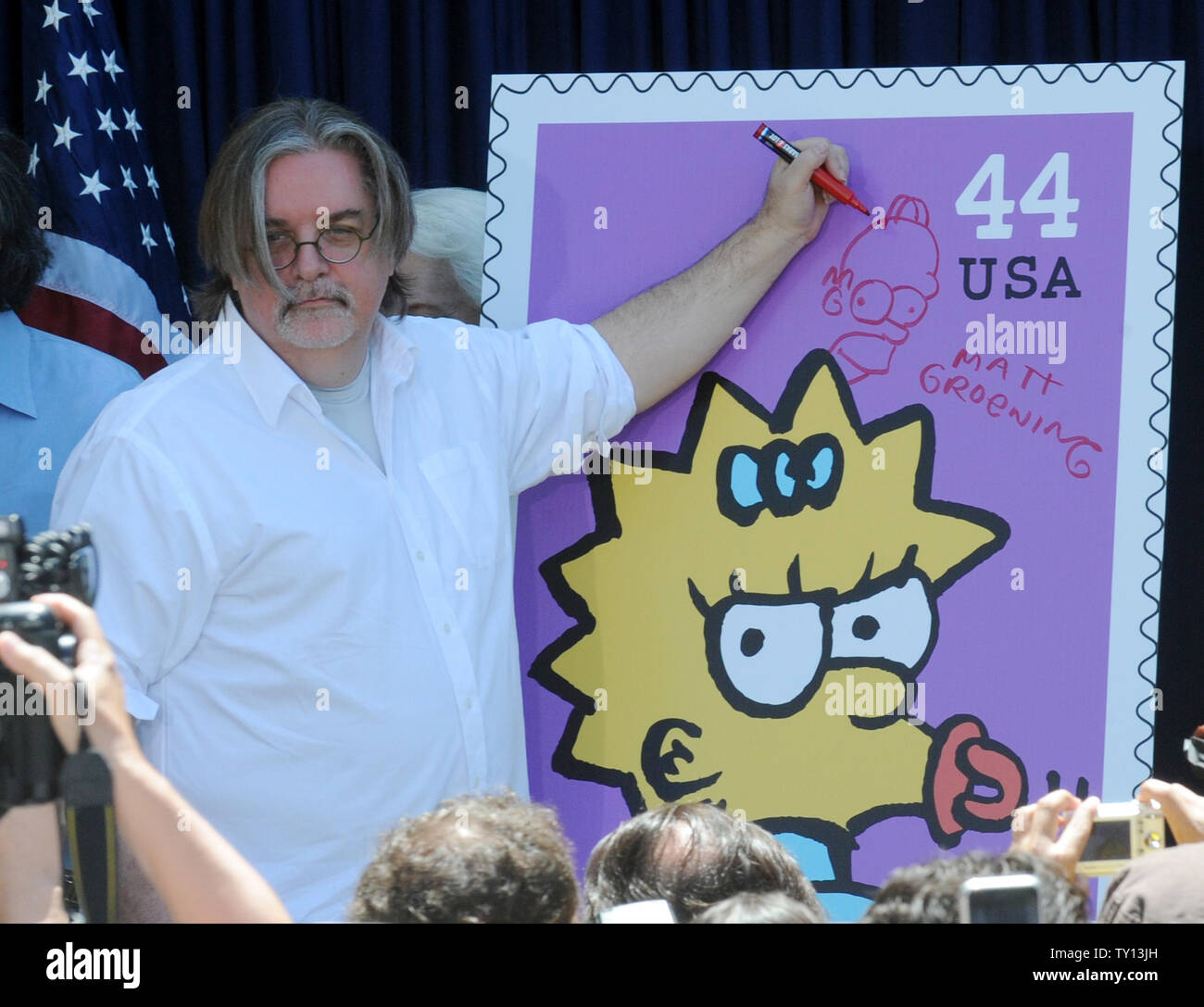 Creator and Executive Producer Matt Groening signs a poster at the unveiling of the new "The Simpsons" U.S. postage stamps in Los Angeles May 7, 2009. (UPI Photo/Jim Ruymen) Stock Photo