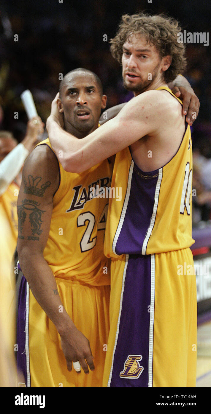 Los Angeles Lakers' Kobe Bryant gets a hug from Pau Gasol at the end of  Game 1 of their Western Conference finals series after they beat the Denver  Nuggets at Staples Center