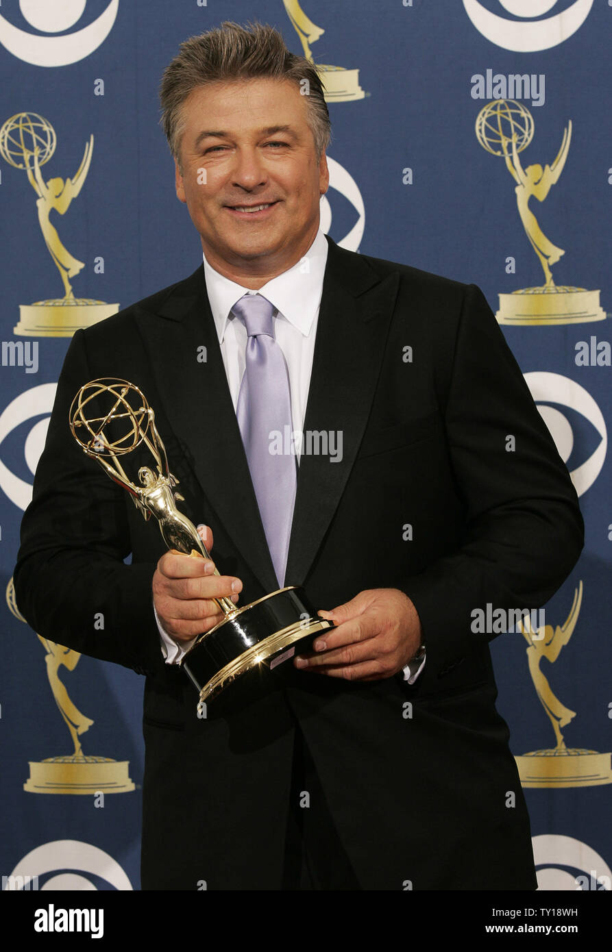 Actor Alec Baldwin holds his award for Outstanding Lead Actor in a