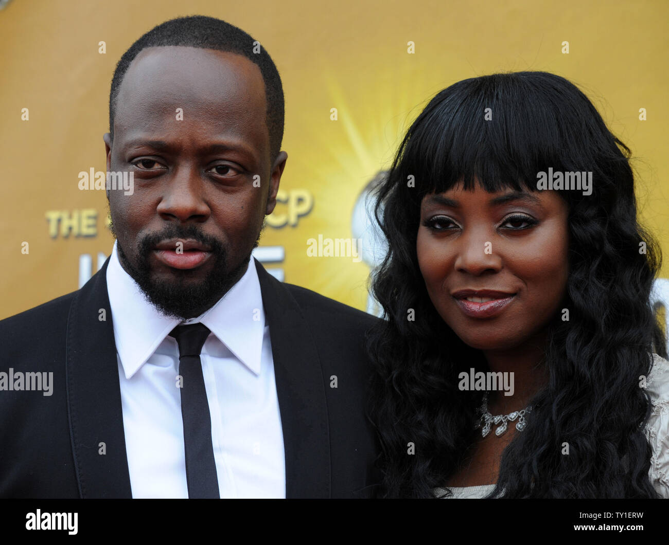 Singer Wyclef Jean and his wife Marie Claudinette attends the 41st