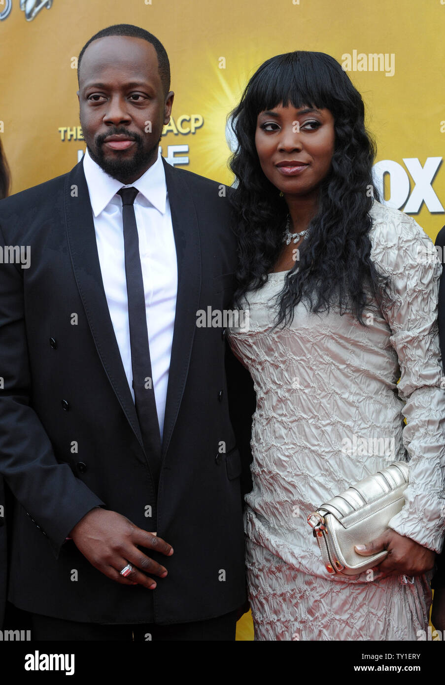 Singer Wyclef Jean and his wife Marie Claudinette attends the 41st