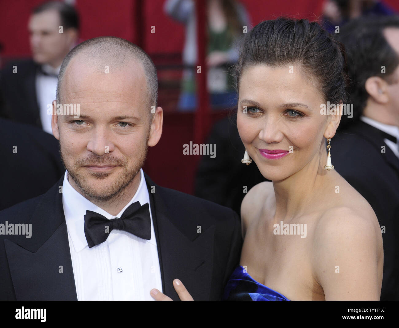 Nominee for Best Actress in a Supporting Role Maggie Gyllenhaal and her husband Peter Sarsgaard arrive on the red carpet at the 82nd Academy Awards in Hollywood on March 7, 2010.   UPI/Phil McCarten Stock Photo