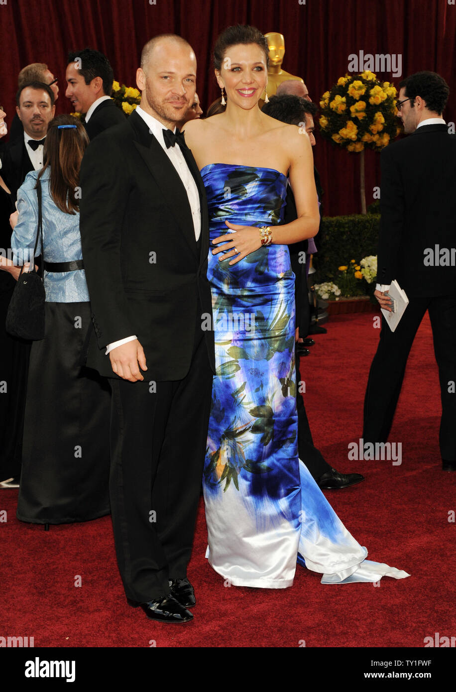 Actress Maggie Gyllenhaal and her husband, actor Peter Sarsgaard arrive at the 82nd annual Academy Awards in Hollywood on March 7, 2010.     UPI/Jim Ruymen Stock Photo
