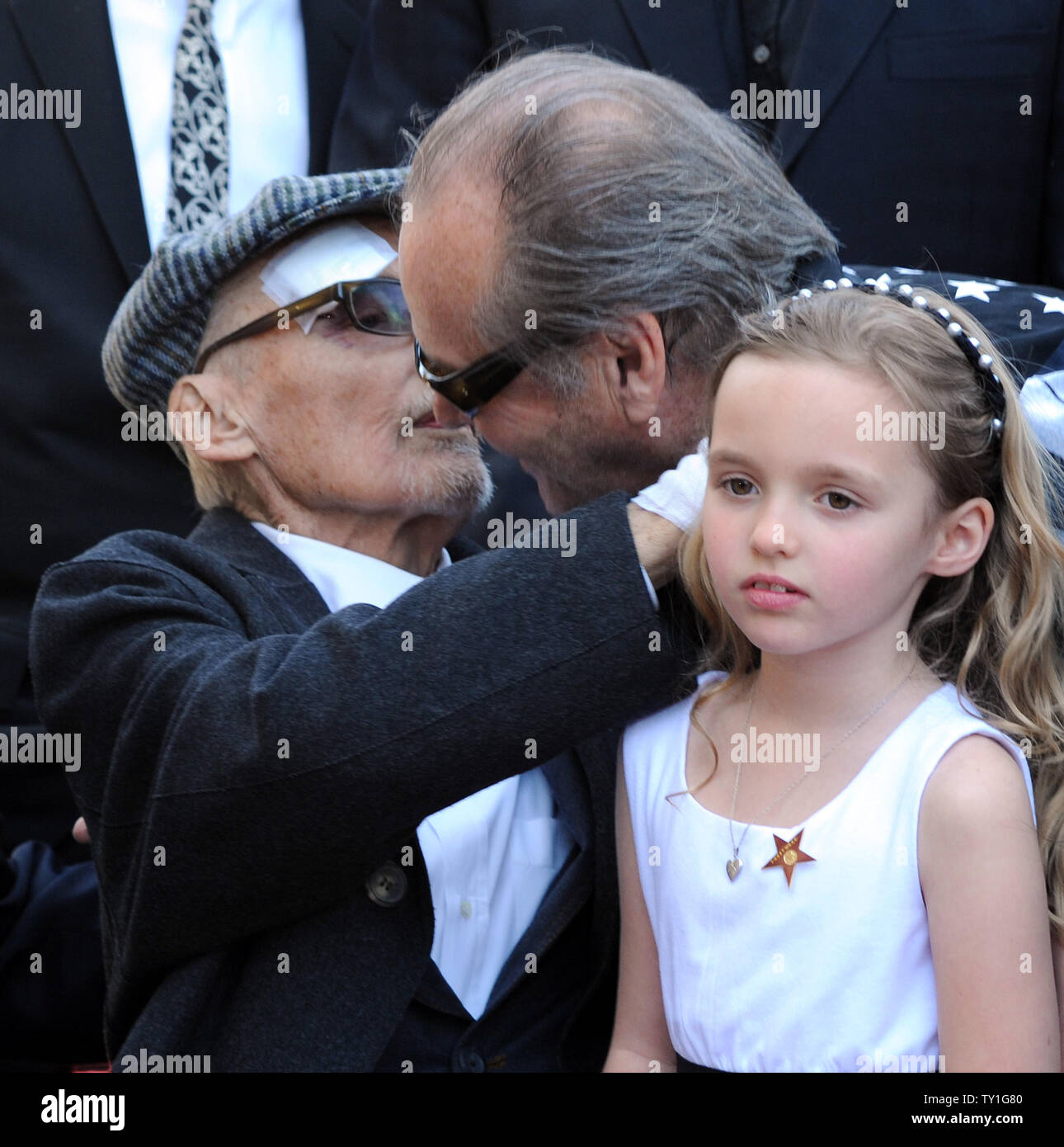 Actor Dennis Hopper (L) is greeted by actor Jack Nicholson, as his