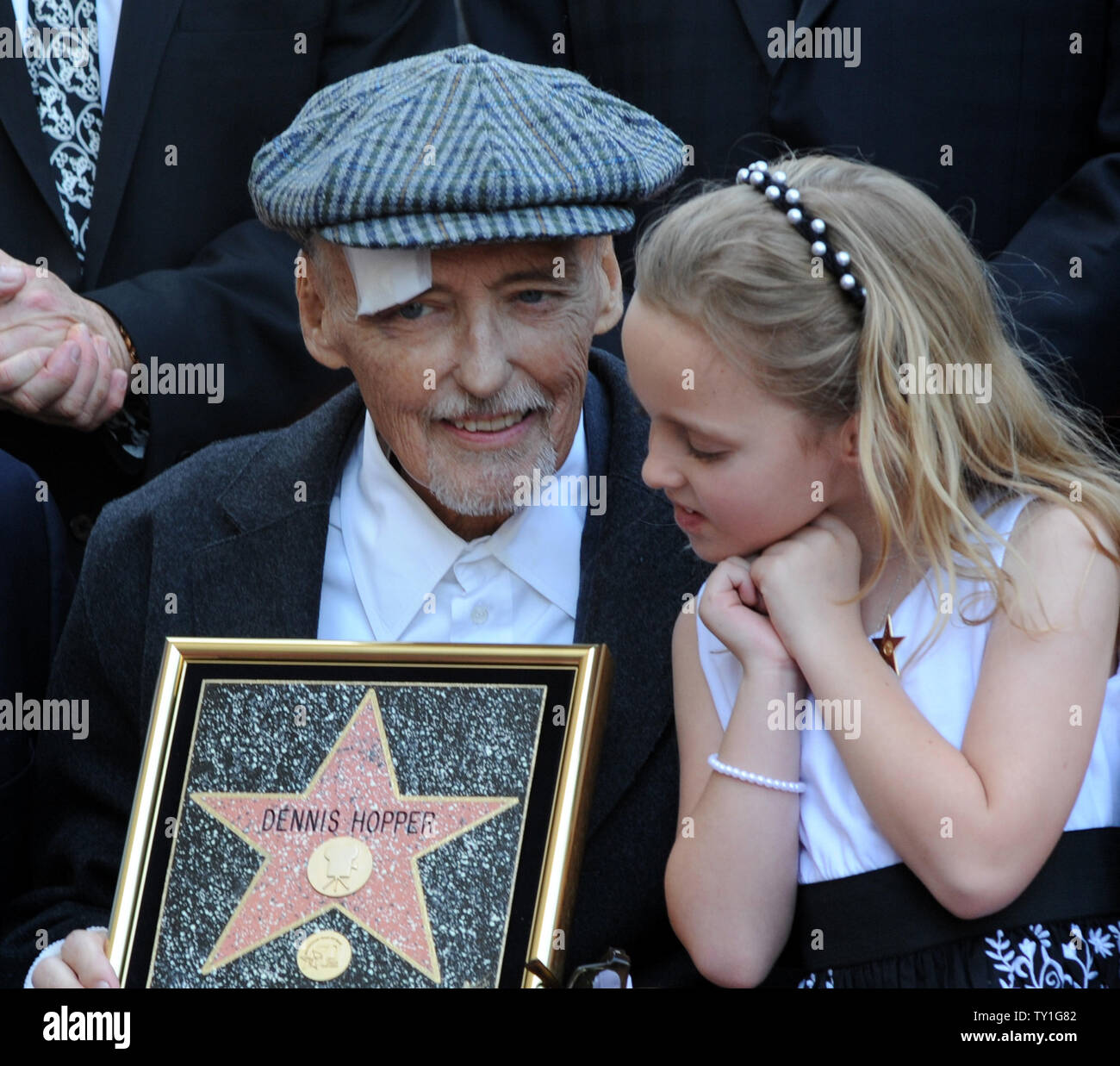 Actor Dennis Hopper looks on as his daughter Galen reacts during a