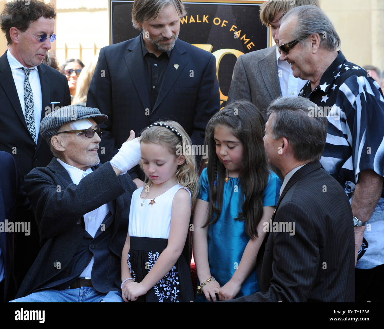 Actor Dennis Hopper (L) is greeted by actor Jack Nicholson, as his