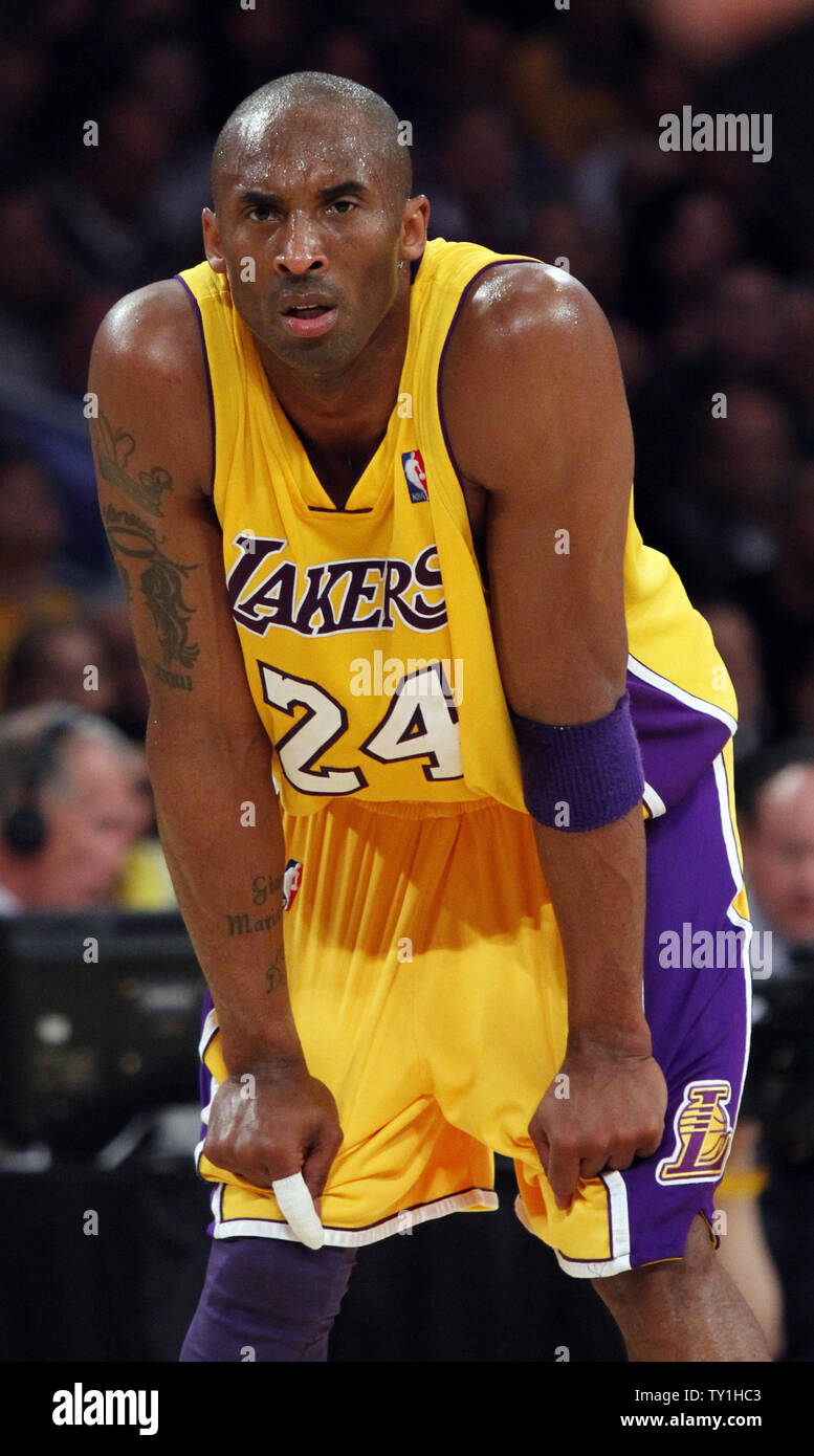 Los Angeles Lakers' Kobe Bryant sports a new, shorter haircut during the  opener of their best-of-five first-round Western Conference playoff series  against the Portland Trail Blazers in Los Angeles, Sunday, April 21