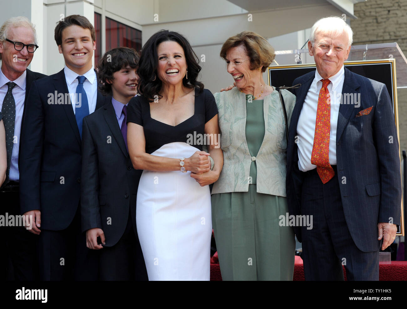 Actress Julia Louis-Dreyfus (4th-L) is flanked by  her husband Brad Hall (L) and their sons Henry (2nd-L) and Charlie and her mother Judy Bowles and stepfather L. Thompson Bowles during an unveiling ceremony honoring her with the 2,407th star on the Hollywood Walk of Fame in Los Angeles on May 4, 2010.     UPI/Jim Ruymen Stock Photo