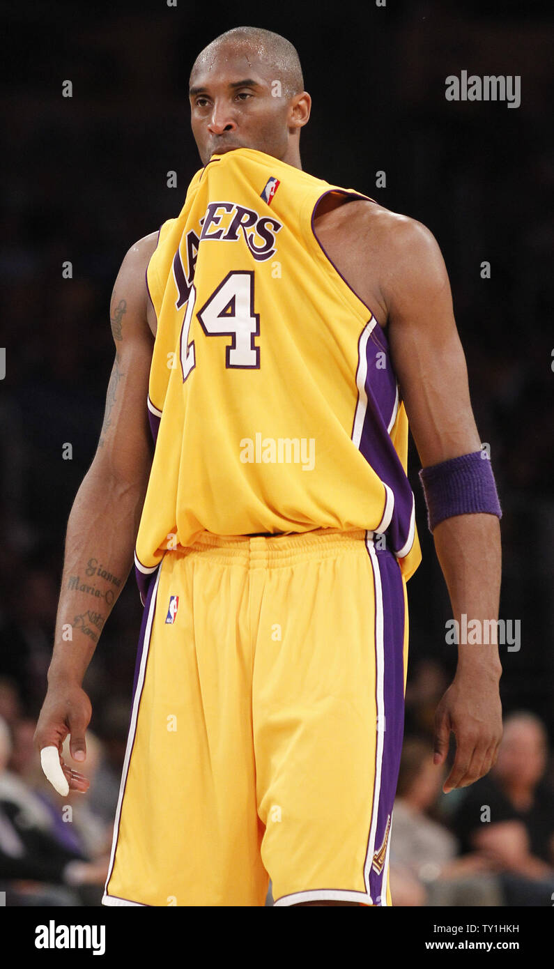 Los Angeles Lakers Kobe Bryant bites his jersey in the fourth quarter  against the New York Knicks at Madison Square Garden in New York City on  February 10, 2012. The Knicks defeated