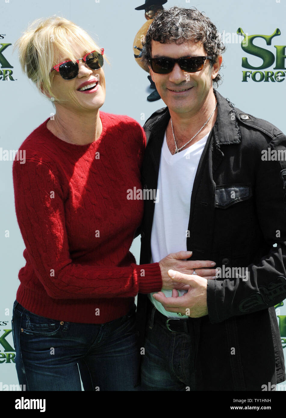 Spanish actor Antonio Banderas (R), the voice of Puss and Boots in the  animated motion picture comedy "Shrek Forever After", attends the premiere  of the film with his wife, actress Melanie Griffith